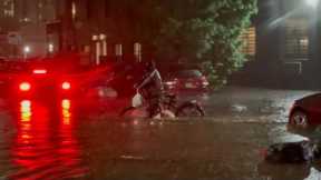 Delivery Man Pushing Bike Through Flood Waters Sparks Outrage